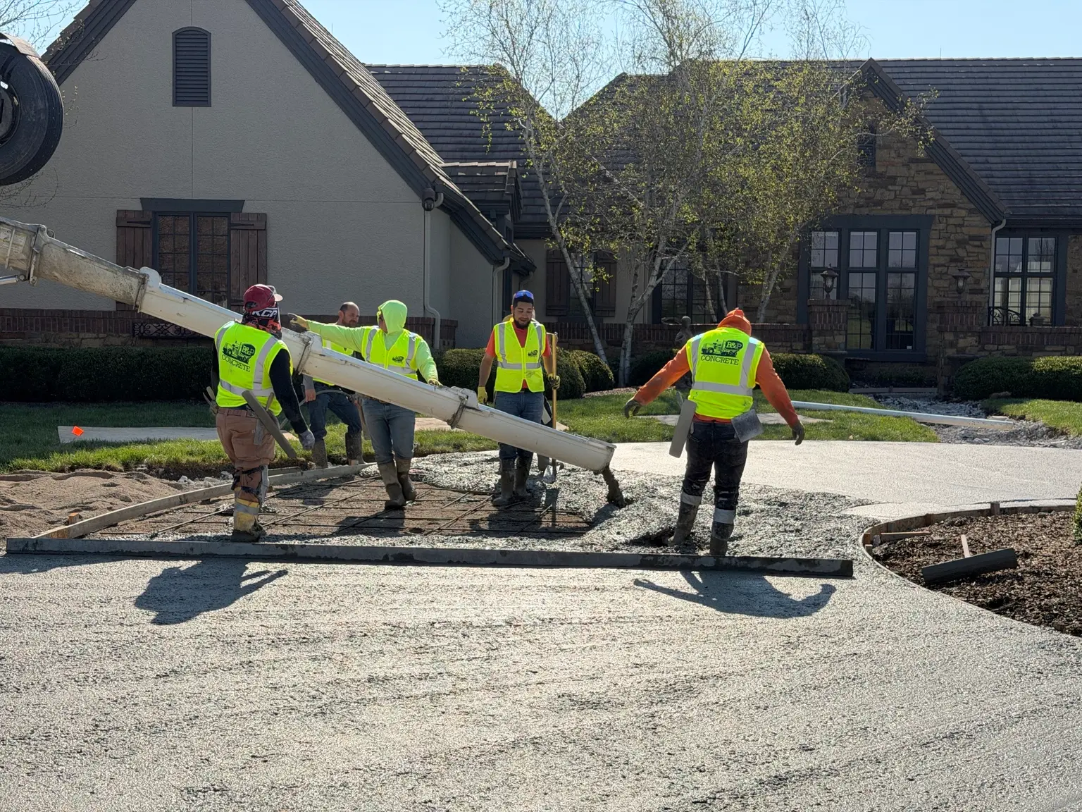 B&P Concrete crew pouring a residential concrete driveway