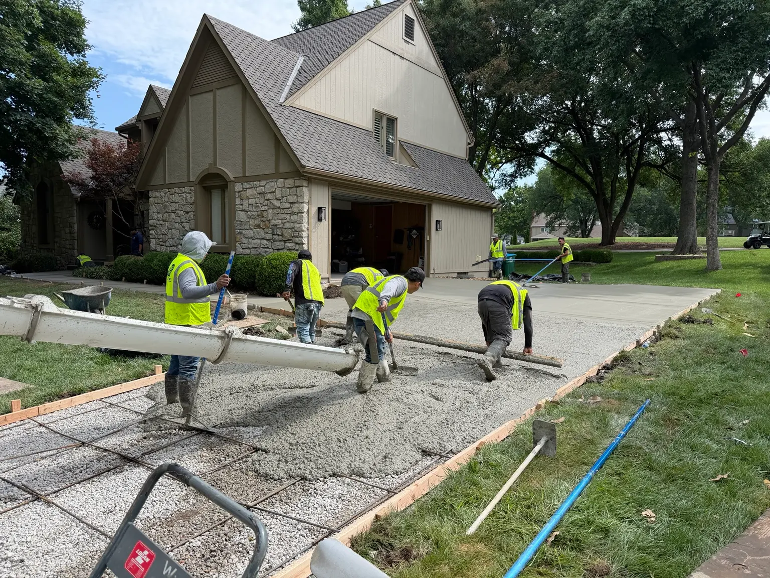 B&P Concrete crew pouring and screeding a residential concrete driveway