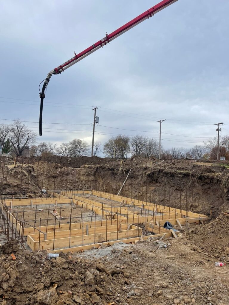 Formed concrete foundation footings with reinforcement prepared for a residential project