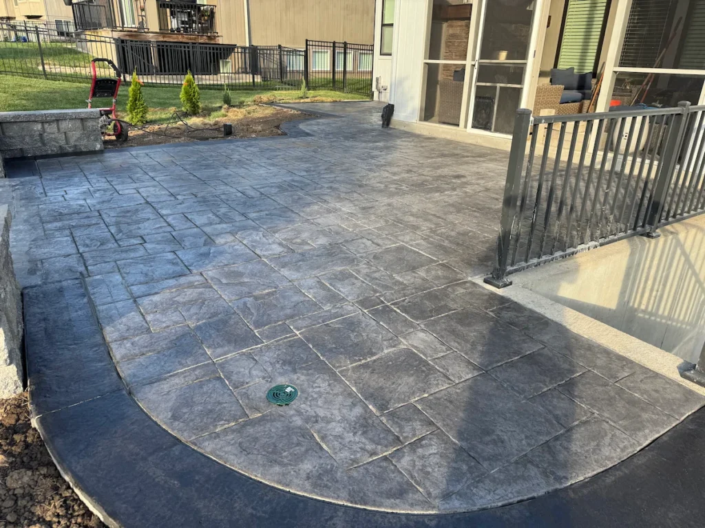 Finished gray stamped concrete patio at residential home