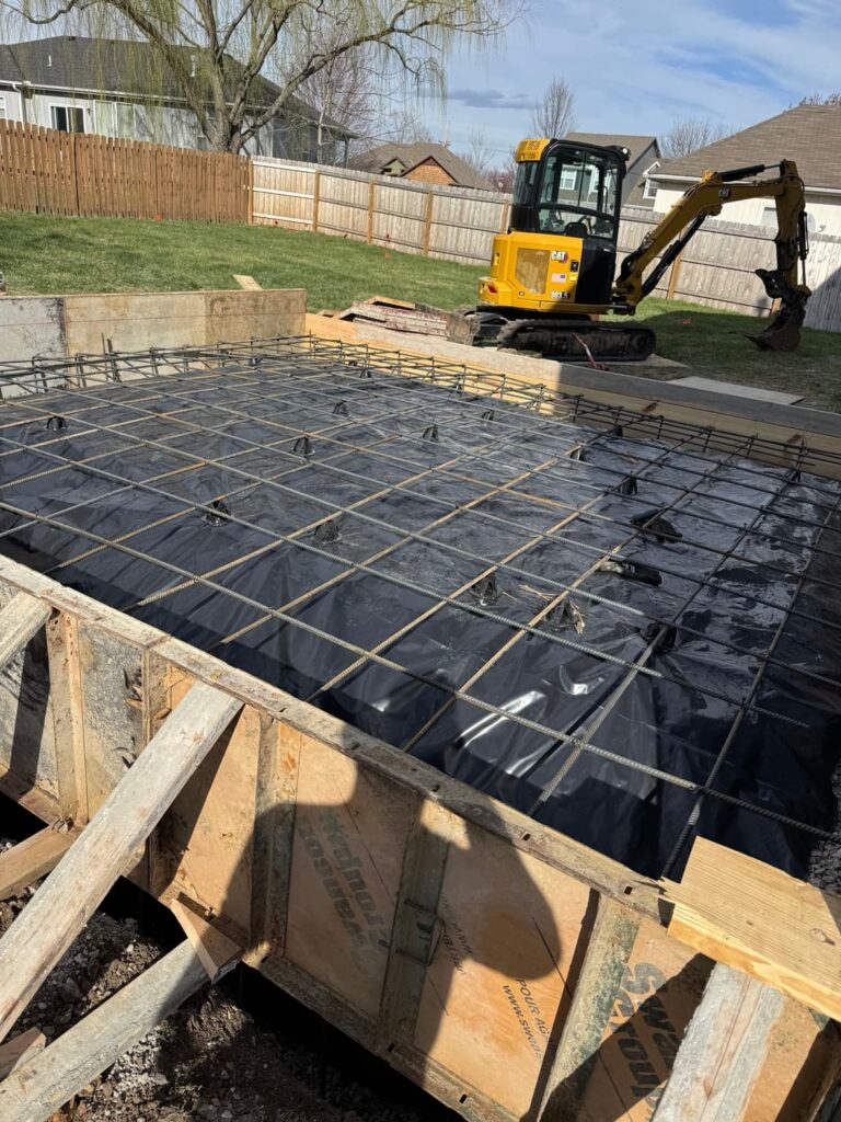 Reinforcement installed for a residential concrete foundation slab before concrete placement