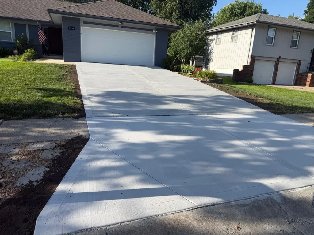 Finished residential concrete driveway replacement by B&P Concrete