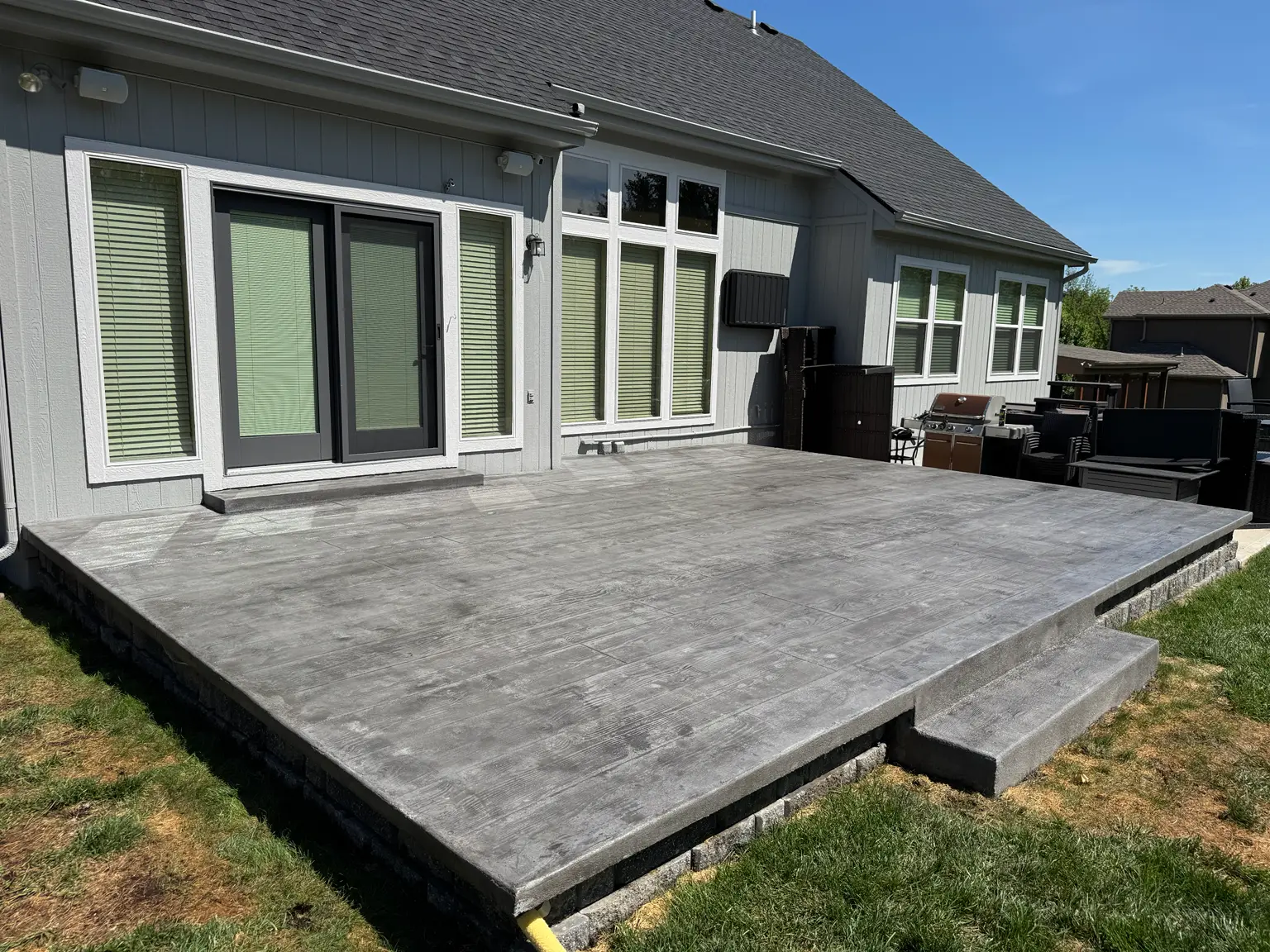 Gray stamped concrete patio installed by B&P Concrete in the Kansas City area